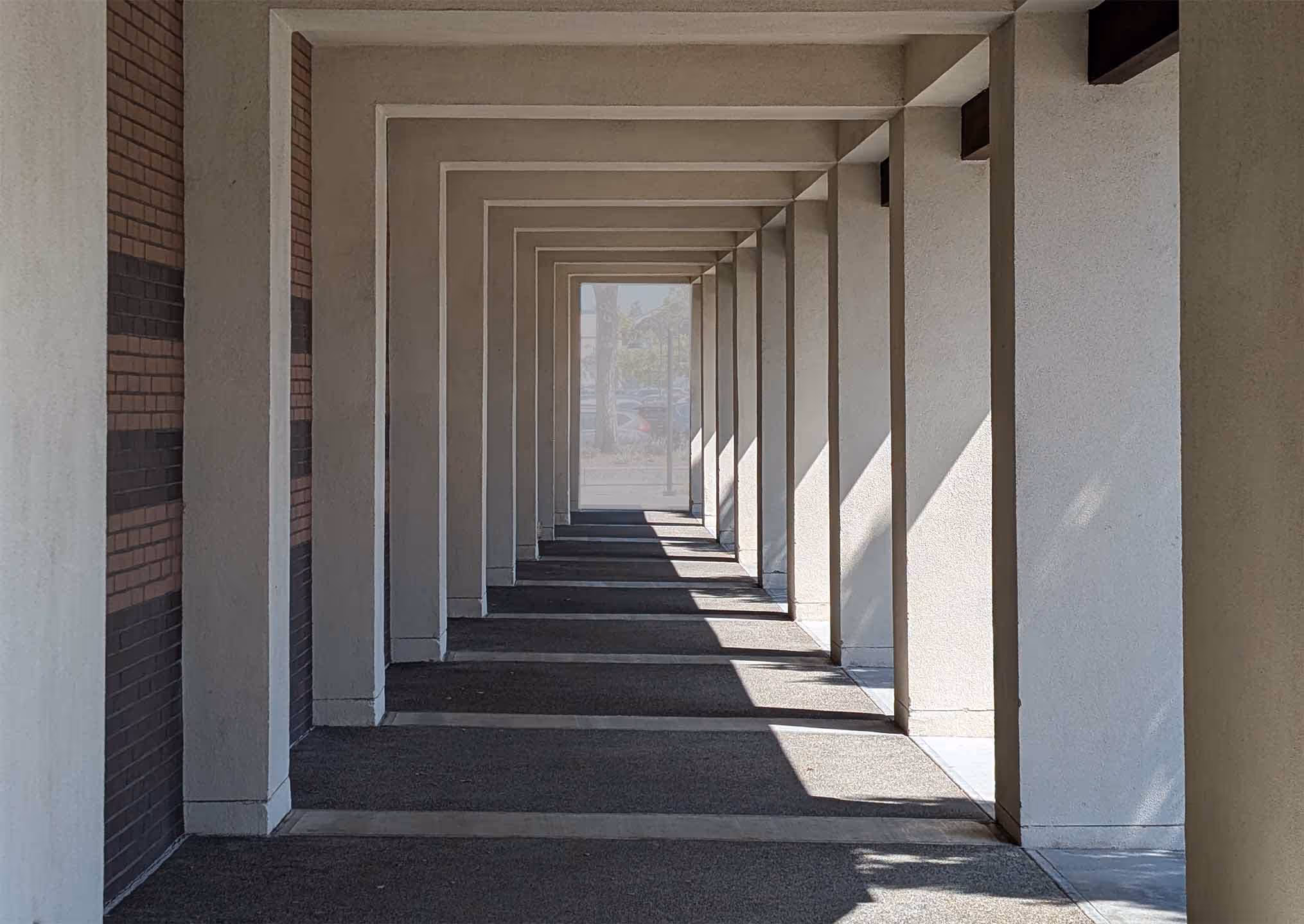 Modern architectural hallway with dramatic lighting